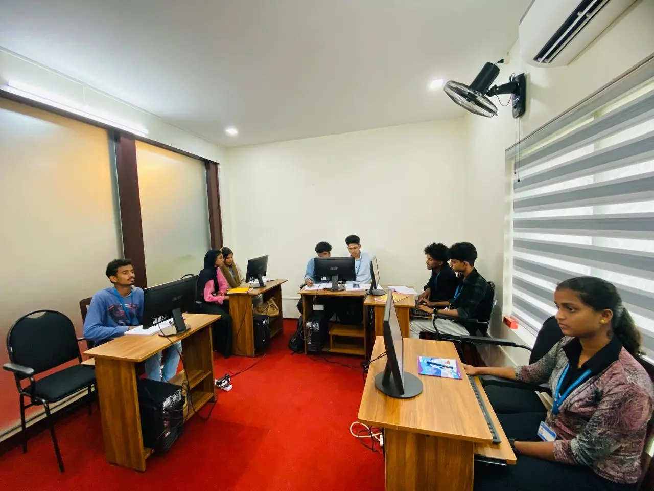 Live classroom coding session with students learning full stack development.